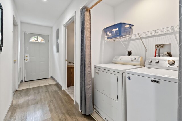 5830 Old Keno Rd, Burnside, KY 42519 - washroom featuring light wood-style flooring, independent washer and dryer, and baseboards