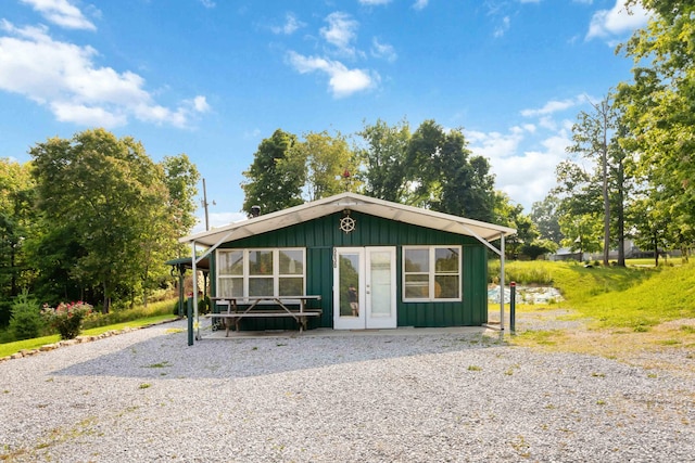 5830 Old Keno Rd, Burnside, KY 42519 - view of front of home with board and batten siding and french doors
