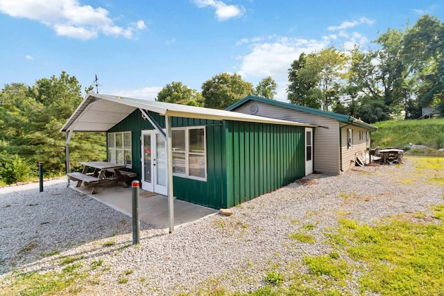 5830 Old Keno Rd, Burnside, KY 42519 - view of property exterior featuring board and batten siding and a patio