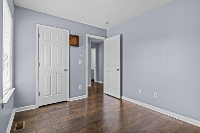 2508 Patrick Henry Way, Lexington, KY 40509 - unfurnished bedroom with baseboards and wood finished floors