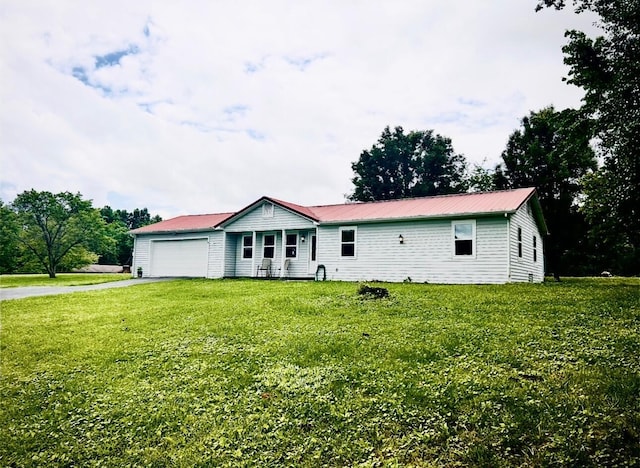 127 Circle St, London, KY 40744 - single story home with an attached garage, driveway, a front lawn, and a metal roof