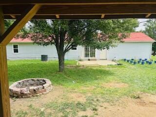 127 Circle St, London, KY 40744 - view of green lawn featuring a fire pit and a patio