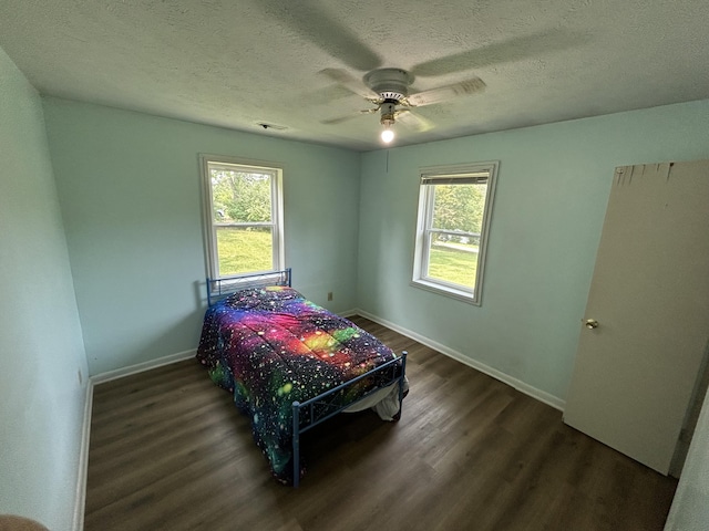 127 Circle St, London, KY 40744 - bedroom with dark wood-type flooring, a textured ceiling, and ceiling fan