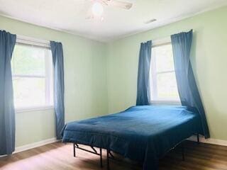 127 Circle St, London, KY 40744 - bedroom featuring wood finished floors, baseboards, multiple windows, and a ceiling fan