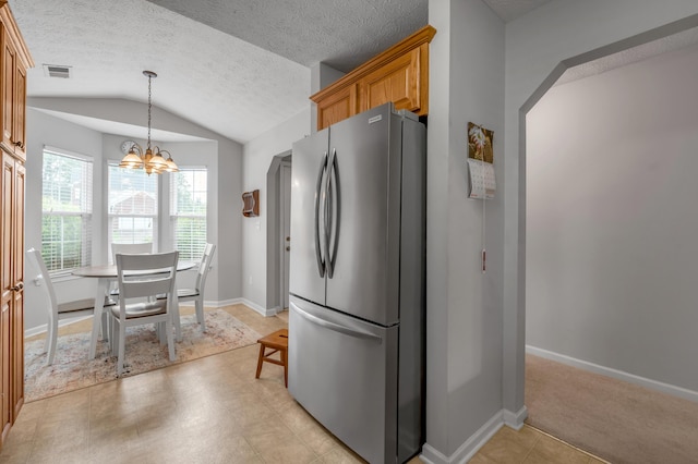 408 Joseph Bryan Way, Lexington, KY 40514 - kitchen with freestanding refrigerator, lofted ceiling, a chandelier, baseboards, and a textured ceiling