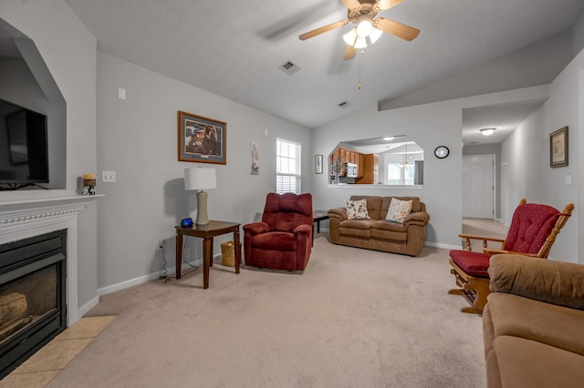 408 Joseph Bryan Way, Lexington, KY 40514 - living area featuring vaulted ceiling, a ceiling fan, carpet, baseboards, and a fireplace with flush hearth