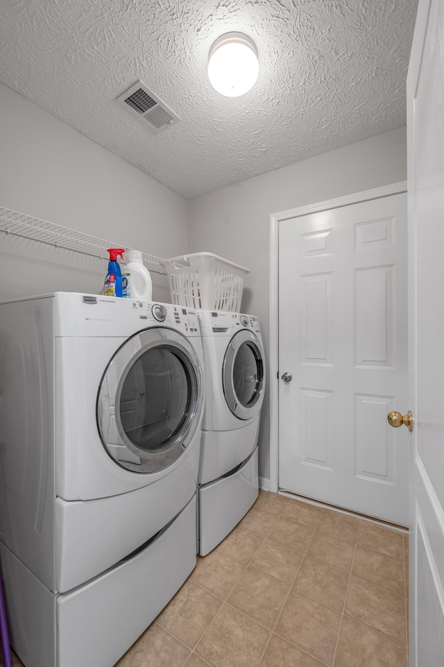 408 Joseph Bryan Way, Lexington, KY 40514 - washroom with washer and dryer, a textured ceiling, and light tile patterned floors