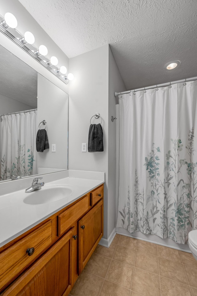 408 Joseph Bryan Way, Lexington, KY 40514 - bathroom with vanity, toilet, a textured ceiling, and tile patterned flooring