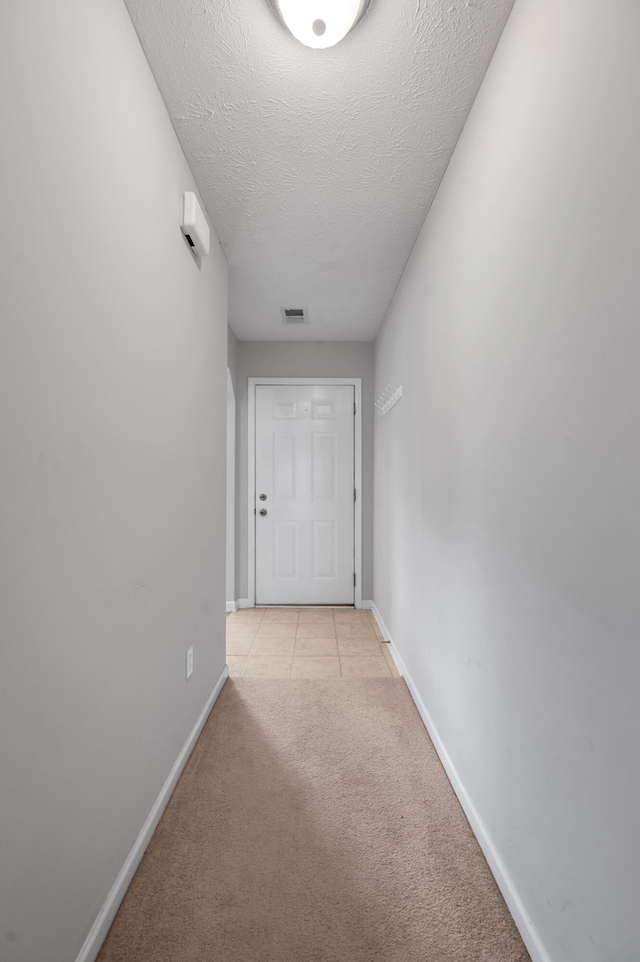 408 Joseph Bryan Way, Lexington, KY 40514 - corridor featuring baseboards, light carpet, light tile patterned flooring, and a textured ceiling