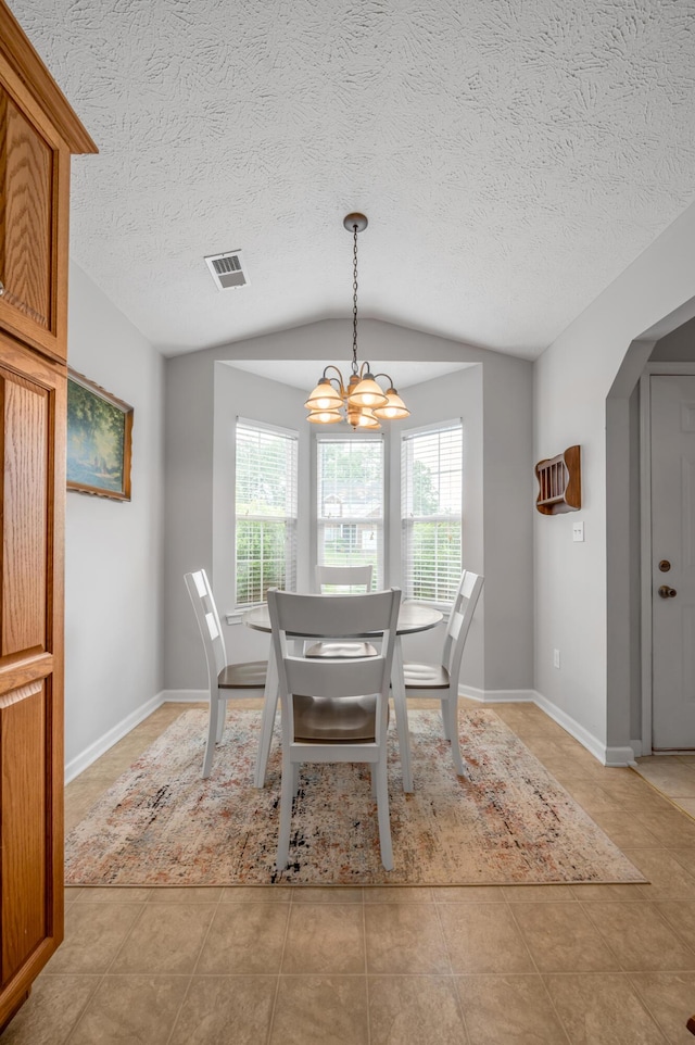 408 Joseph Bryan Way, Lexington, KY 40514 - dining area with vaulted ceiling, a chandelier, light tile patterned floors, arched walkways, and a textured ceiling