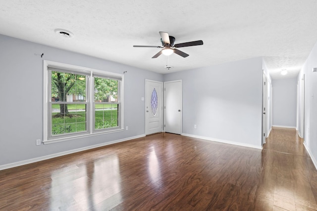 1609 Magna Oak Dr, Lexington, KY 40515 - empty room with wood finished floors, a ceiling fan, a textured ceiling, and baseboards
