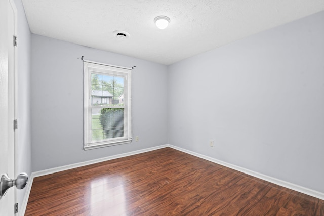 1609 Magna Oak Dr, Lexington, KY 40515 - empty room with wood finished floors, baseboards, and a textured ceiling