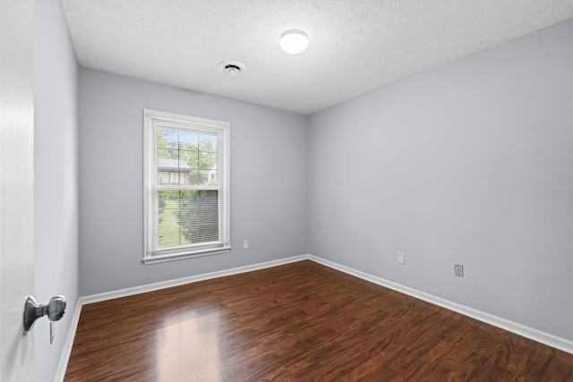 1609 Magna Oak Dr, Lexington, KY 40515 - unfurnished room with wood finished floors, baseboards, and a textured ceiling