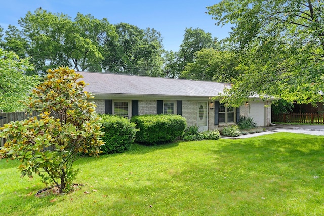 1609 Magna Oak Dr, Lexington, KY 40515 - ranch-style home featuring an attached garage, brick siding, concrete driveway, and roof with shingles
