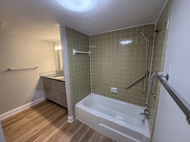 175 Malabu Dr Unit 60, Lexington, KY 40503 - full bathroom featuring a textured ceiling, shower / washtub combination, wood finished floors, vanity, and baseboards