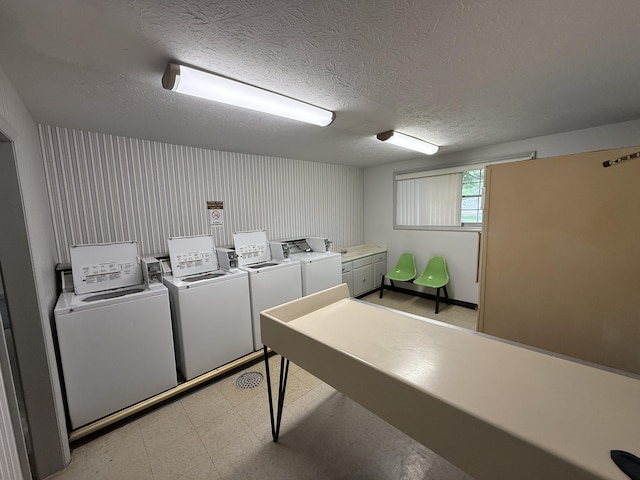 175 Malabu Dr Unit 60, Lexington, KY 40503 - shared laundry with washer and clothes dryer, light floors, and a textured ceiling