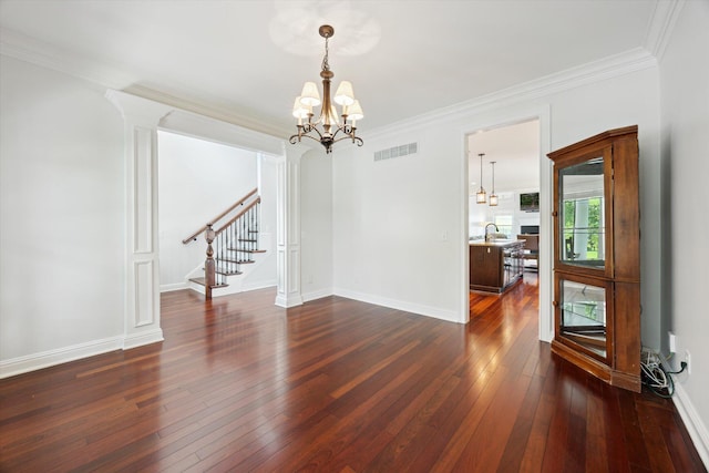 1821 Goodpaster Way, Lexington, KY 40505 - empty room featuring stairway, a chandelier, dark wood-style floors, crown molding, and a sink