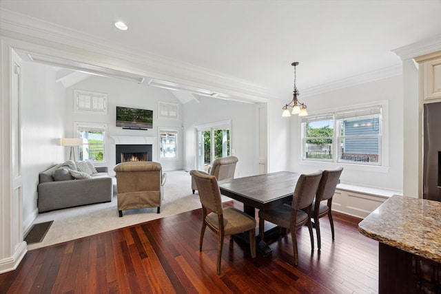 1821 Goodpaster Way, Lexington, KY 40505 - dining space with dark wood-type flooring, a lit fireplace, baseboards, crown molding, and vaulted ceiling