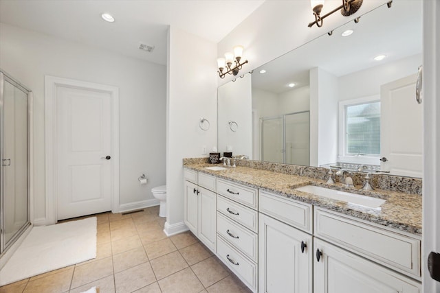 1821 Goodpaster Way, Lexington, KY 40505 - bathroom with double vanity, a shower stall, toilet, tile patterned floors, and baseboards