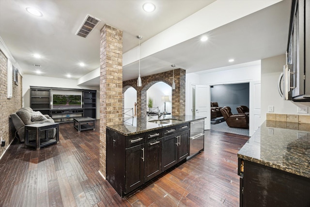 1821 Goodpaster Way, Lexington, KY 40505 - kitchen featuring open floor plan, decorative columns, dark wood-style floors, a sink, and recessed lighting