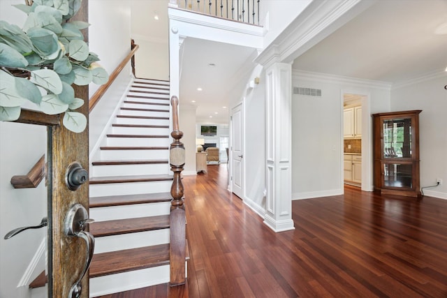 1821 Goodpaster Way, Lexington, KY 40505 - foyer entrance with ornate columns, wood finished floors, crown molding, stairway, and baseboards