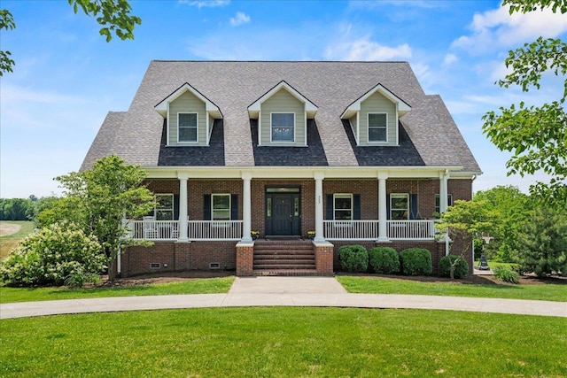 553 White Oak Rd, Stamping Ground, KY 40379 - cape cod home featuring brick siding, a front yard, and covered porch