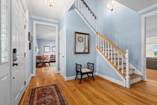 553 White Oak Rd, Stamping Ground, KY 40379 - foyer entrance featuring stairway, light wood-style floors, ornamental molding, and baseboards
