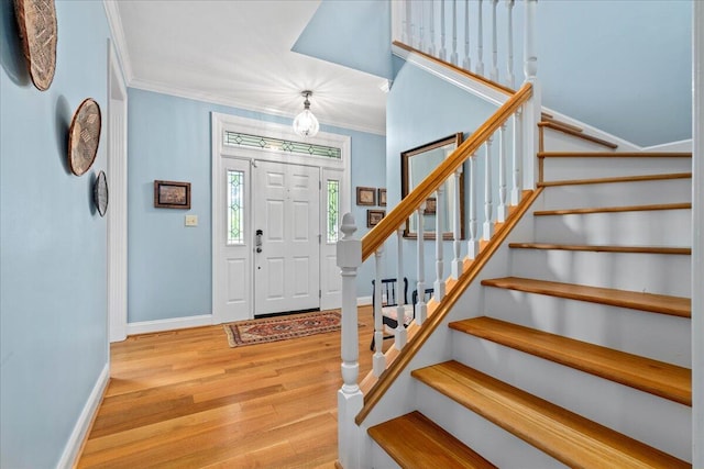 553 White Oak Rd, Stamping Ground, KY 40379 - foyer featuring crown molding, stairway, wood finished floors, and baseboards