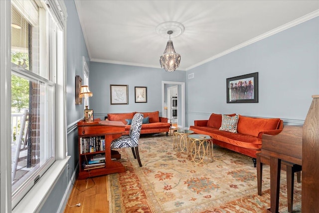 553 White Oak Rd, Stamping Ground, KY 40379 - living room featuring ornamental molding, wood finished floors, and a chandelier