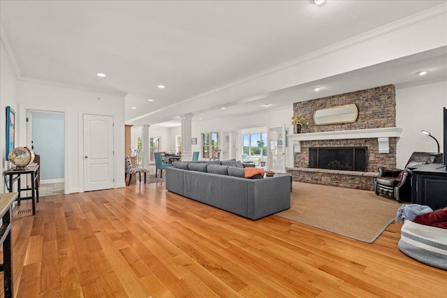 553 White Oak Rd, Stamping Ground, KY 40379 - living room featuring decorative columns, light wood-style floors, a fireplace, crown molding, and recessed lighting