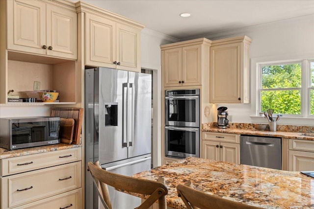 553 White Oak Rd, Stamping Ground, KY 40379 - kitchen featuring appliances with stainless steel finishes, cream cabinetry, light stone countertops, ornamental molding, and recessed lighting