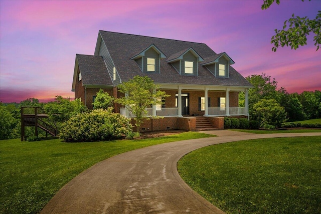 553 White Oak Rd, Stamping Ground, KY 40379 - cape cod-style house with a porch, a front lawn, brick siding, and stairs