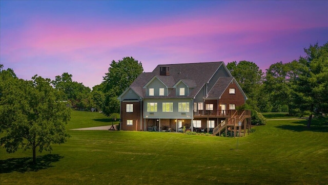 553 White Oak Rd, Stamping Ground, KY 40379 - back of property at dusk featuring a deck, a yard, and stairs