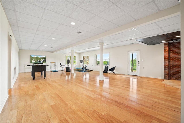 553 White Oak Rd, Stamping Ground, KY 40379 - workout room with decorative columns, a drop ceiling, plenty of natural light, wood finished floors, and baseboards