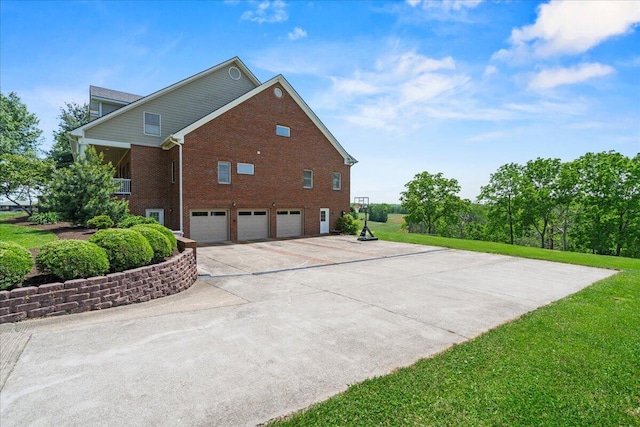 553 White Oak Rd, Stamping Ground, KY 40379 - view of side of home featuring a garage, brick siding, and driveway