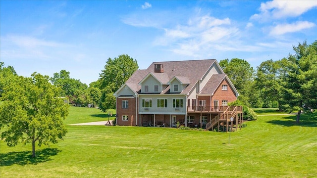 553 White Oak Rd, Stamping Ground, KY 40379 - rear view of property with stairs, a deck, a lawn, and brick siding