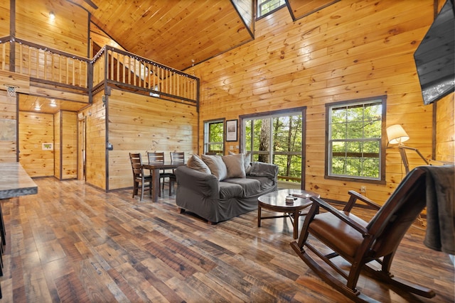 222 Muir Rd, Rogers, KY 41365 - living room with wooden walls, wood-type flooring, and high vaulted ceiling