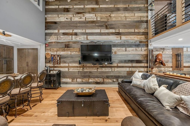 517 W Main St, Lexington, KY 40507 - living area featuring a high ceiling, wood walls, and wood finished floors