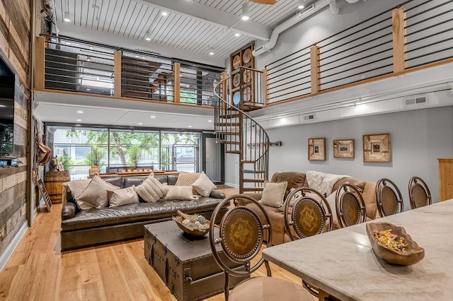 517 W Main St, Lexington, KY 40507 - living area featuring hardwood / wood-style floors, a towering ceiling, and stairway