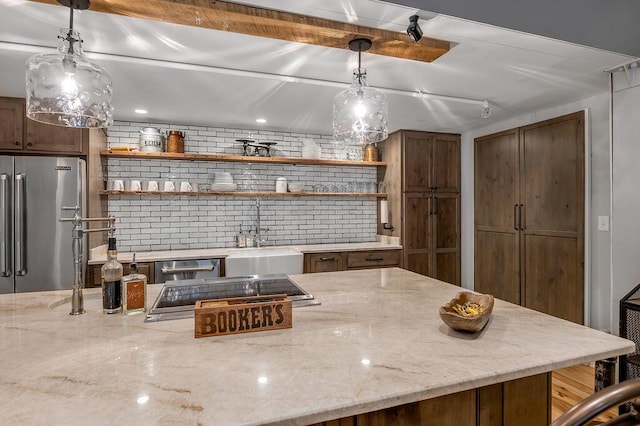 517 W Main St, Lexington, KY 40507 - kitchen featuring high end refrigerator, a sink, open shelves, backsplash, and light stone counters