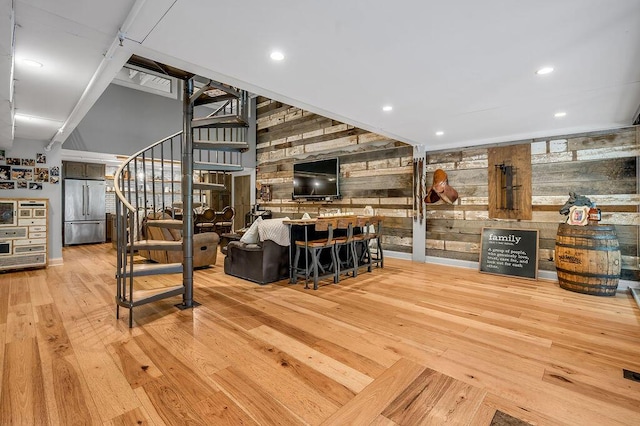 517 W Main St, Lexington, KY 40507 - bar with stainless steel fridge, wooden walls, stairs, wood-type flooring, and recessed lighting