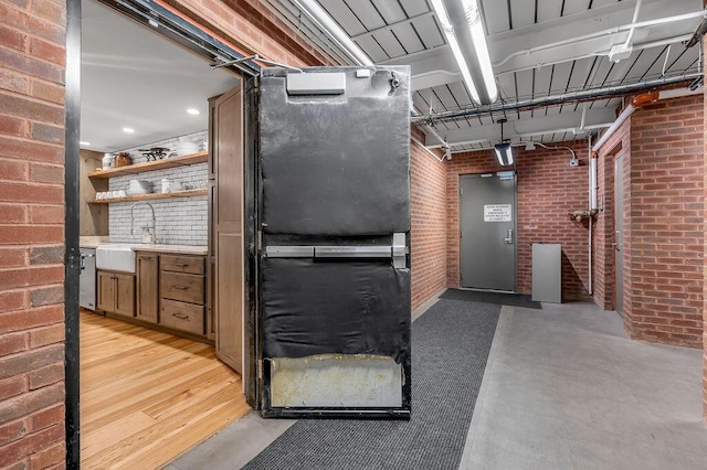 517 W Main St, Lexington, KY 40507 - below grade area featuring a sink and brick wall