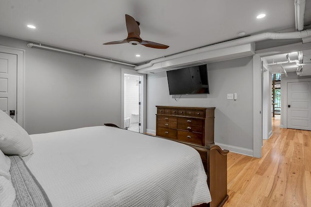 517 W Main St, Lexington, KY 40507 - bedroom with light wood finished floors, baseboards, recessed lighting, a ceiling fan, and connected bathroom
