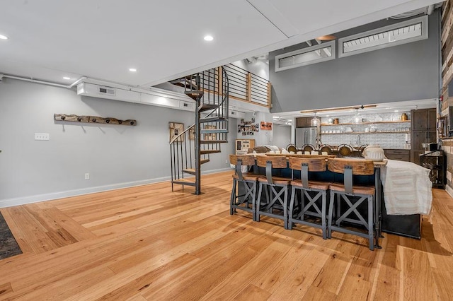 517 W Main St, Lexington, KY 40507 - kitchen with wood finished floors, baseboards, freestanding refrigerator, recessed lighting, and open shelves