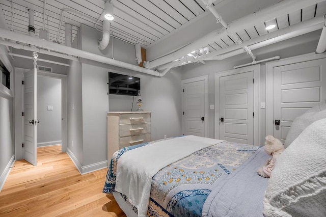 517 W Main St, Lexington, KY 40507 - bedroom with baseboards and wood finished floors