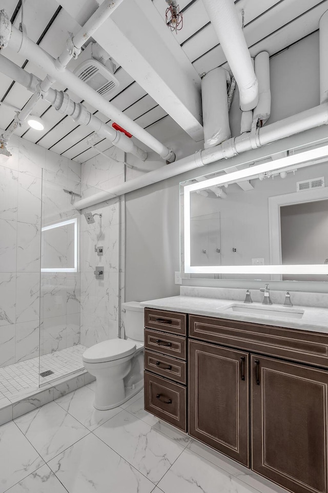 517 W Main St, Lexington, KY 40507 - full bathroom featuring marble look tile flooring, vanity, a marble finish shower, and toilet