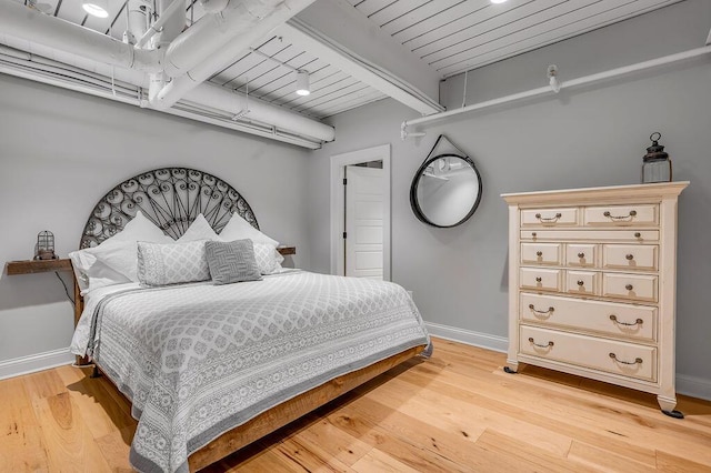 517 W Main St, Lexington, KY 40507 - bedroom with baseboards, light wood finished floors, and wood ceiling with exposed beams