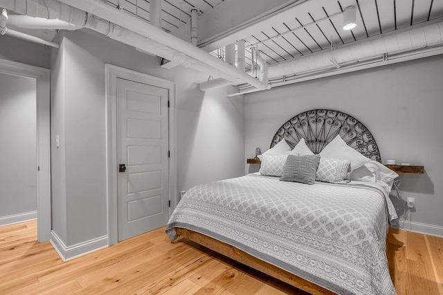 517 W Main St, Lexington, KY 40507 - bedroom with wood-type flooring and baseboards