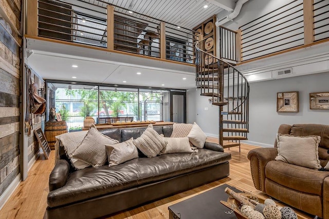 517 W Main St, Lexington, KY 40507 - living area with a towering ceiling, baseboards, stairs, and wood finished floors