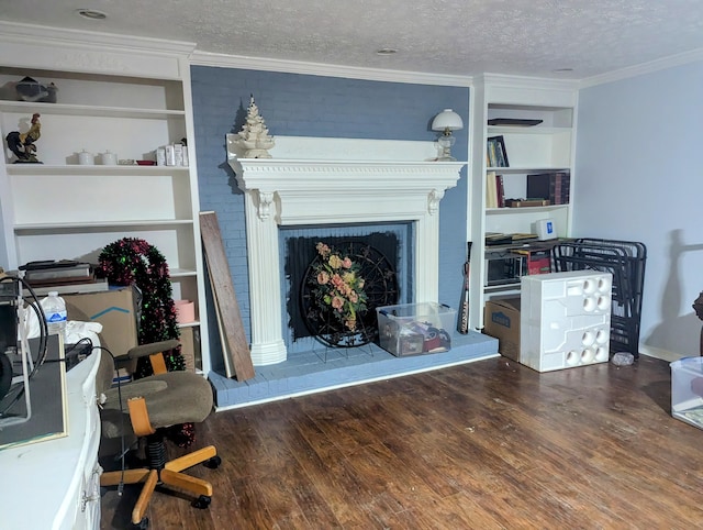 400 Verna Dr, Winchester, KY 40391 - living area featuring wood finished floors, a fireplace with raised hearth, a textured ceiling, ornamental molding, and built in shelves